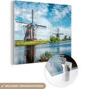 MuchoWow® Glasschilderij 50x50 cm - Schilderij acrylglas - Windmolens aan het water bij Kinderdijk - Foto op glas - Schilderijen