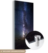 MuchoWow® Glasschilderij 60x120 cm - Schilderij acrylglas - Melkweg aan een donkere hemel - Foto op glas - Schilderijen