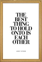 JUNIQE - Poster met houten lijst The Best Thing To Hold Onto Is Each