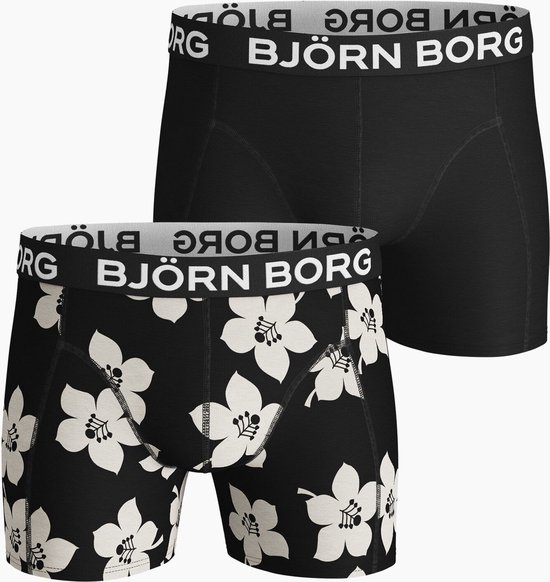 Twee zwarte boxslips, één effen en één met witte bloemenprint. Elastische banden met 'BJÖRN BORG' logo.