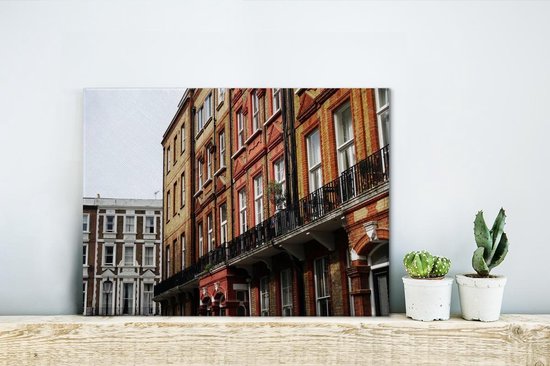 Vue de la façade avec balcons de plusieurs petites maisons Toile 40x30 cm - petite - Tirage photo sur toile (Décoration murale salon / chambre)