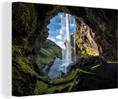 Canvas Schilderij Waterval buiten een grot in IJsland - 60x40 cm - Wanddecoratie