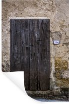 Muurstickers - Sticker Folie - Een oude houten deur bij een oude muur in het Italiaanse Toscane - 20x30 cm - Plakfolie - Muurstickers Kinderkamer - Zelfklevend Behang - Zelfklevend behangpapier - Stickerfolie