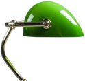 Gros plan d'un abat-jour vert avec des accents dorés.