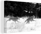 Canvas Schilderij Twee rennende wolven - zwart wit - 30x20 cm - Wanddecoratie