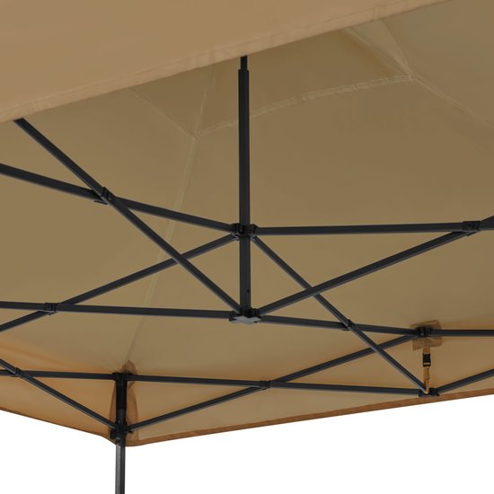 Bovenaanzicht van het beige dak en het zwarte stalen frame van een partytent.