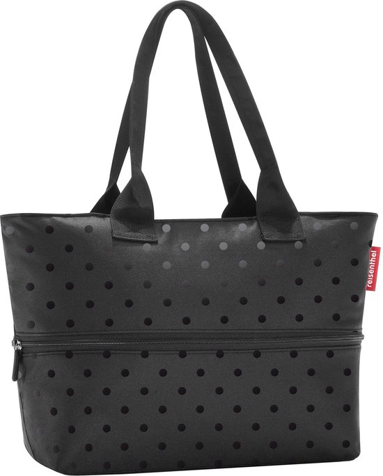 Zwarte shopper met polkadots, dubbele handvatten en een ritsvak onderaan. Rode Reisenthel-tag.