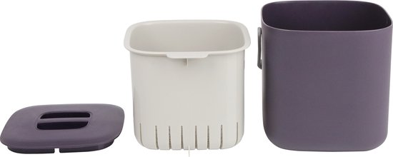 Een paars bakje, een wit binnenbakje met gaatjes en een paars deksel met handvatten.