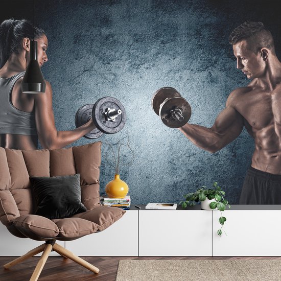 Fotobehang Gespierde Man Een Atletische Vrouw - Vliesbehang - 416 x 254 cm