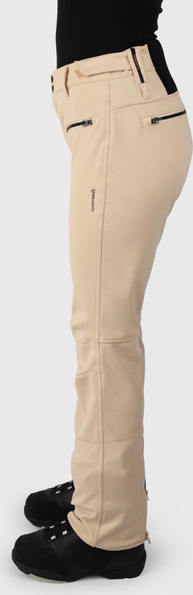 Zijzicht op beige skibroek met zwarte ritsen en logo op de zijkant.