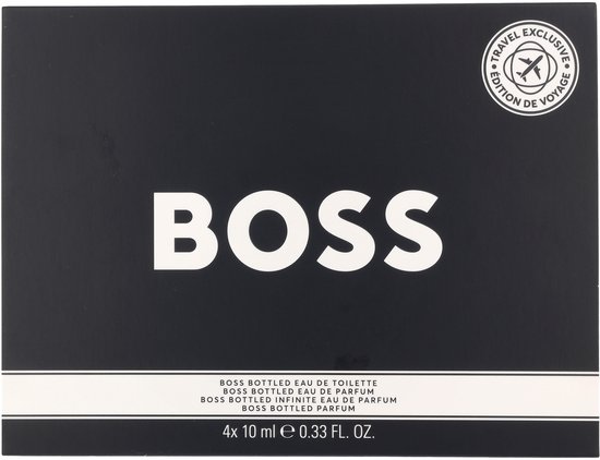 Een zwarte BOSS geschenkdoos met 'TRAVEL EXCLUSIVE EDITION DE VOYAGE' in een cirkel en 'BOSS' in grote witte letters.