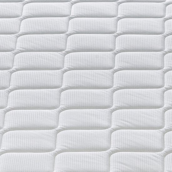Matelas blanc avec coutures losanges et surface texturée.