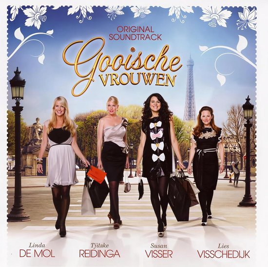 Quatre femmes marchent dans la rue avec des sacs de shopping, avec la Tour Eiffel en arrière-plan. Titré 'Gooische Vrouwen'.