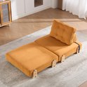 Oranje corduroy slaapfauteuil uitgeklapt, met wigvormig hoofdkussen.