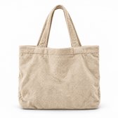 Beige velours tas met twee hengsels, frontaal aanzicht op witte achtergrond.