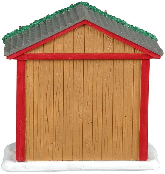 Achterkant van een kerstkraam met houten wanden, een grijs pannendak en een besneeuwde voet.