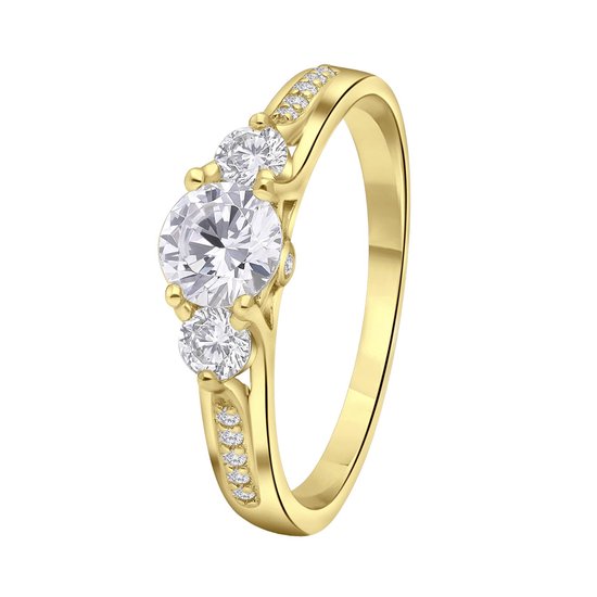 Bague dorée avec trois pierres en zircone. Deux petites pierres de chaque côté d'une grande pierre.