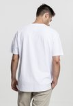 Man met een oversized witte T-shirt, achterkant.