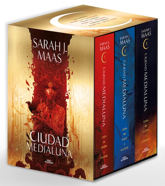 Boxset met de 'Ciudad Medialuna' boeken in het Spaans, met op de voorkant een vrouw en een kraai tegen een rode en gouden achtergrond.