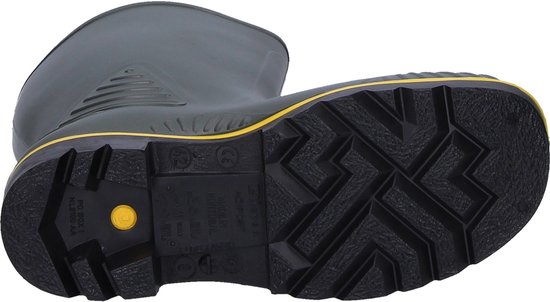 Onderzijde van een zwarte Dunlop laars met grof antislip profiel en een opvallende gele cirkel.