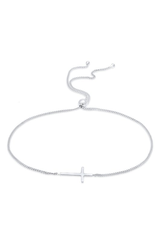 Bracelet argenté orné d'une petite croix placée sur le côté. Le bracelet est réglable par un fermoir coulissant et des perles argentées aux extrémités.