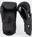 Zwarte VENUM boksring met glanzende opdruk en 16oz aanduiding.