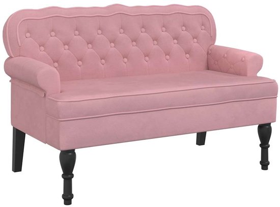 Roze fluwelen bankje met knopen en zwarte pootjes.
