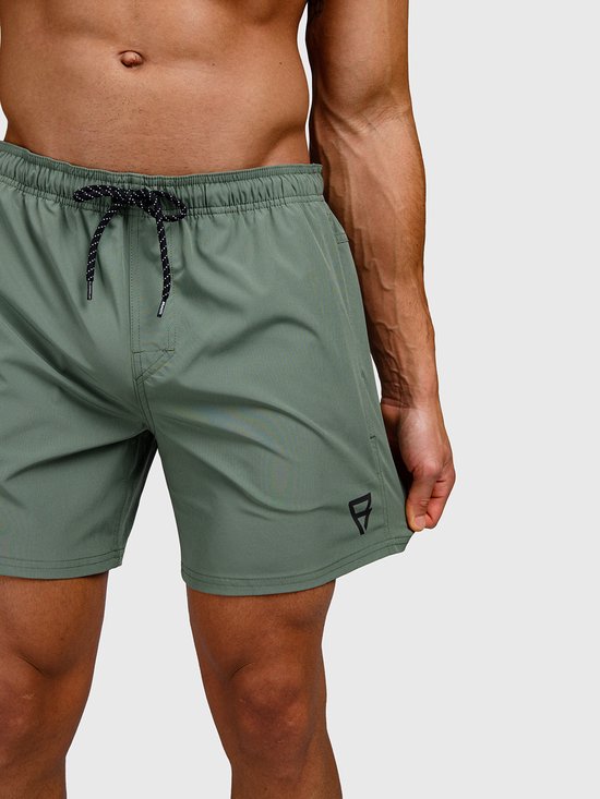 Short de bain vert avec cordon noir et logo sur l'ourlet.