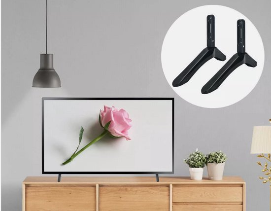 Zwarte TV-standaardpoten op een dressoir voor een TV met een roze roos.