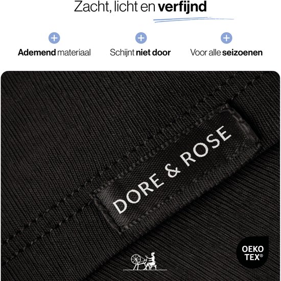 Close-up van zwarte, geribbelde stof met 'DORE & ROSE' label en OEKO TEX logo.