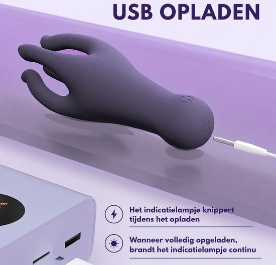 Donkerpaarse vibrator in handvorm wordt opgeladen via USB-kabel. "USB OPLADEN"