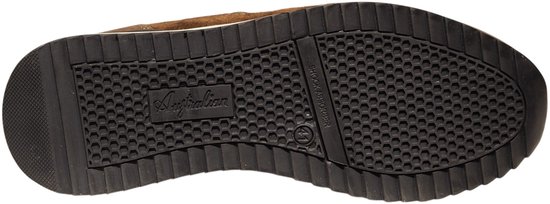 Zool van een bruine sneaker met Australische merknaam en hexagonale grip.