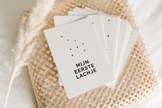 Baby mijlpaalkaarten met sterren en de tekst 'MIJN EERSTE LACHJE'.