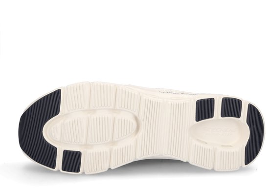 Onderkant van een donkerblauwe Skechers sneaker met witte zool en donkerblauwe antislipzones.