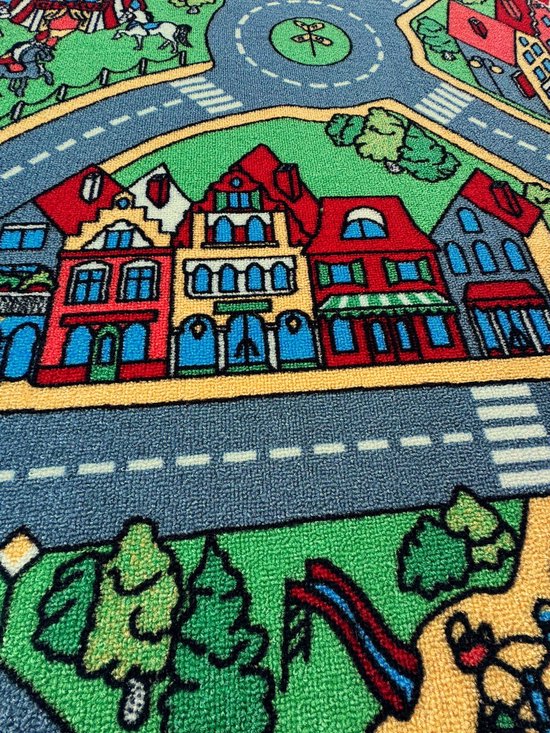 Speelkleed met een rij kleurrijke huizen, wegen en bomen.