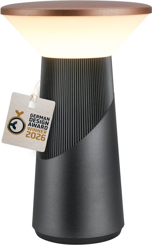 Lampe de table sans fil gris anthracite avec dessus en cuivre et une étiquette 'German Design Award Winner 2026'.