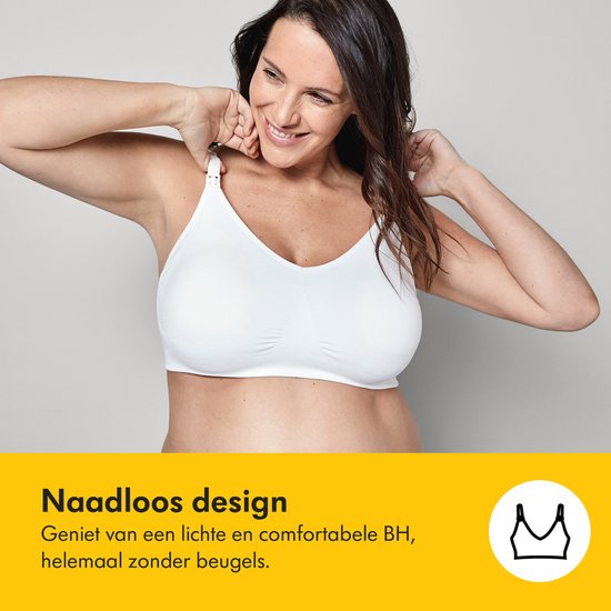 Une femme enceinte souriante porte un soutien-gorge d'allaitement blanc sans couture et sans armatures.
