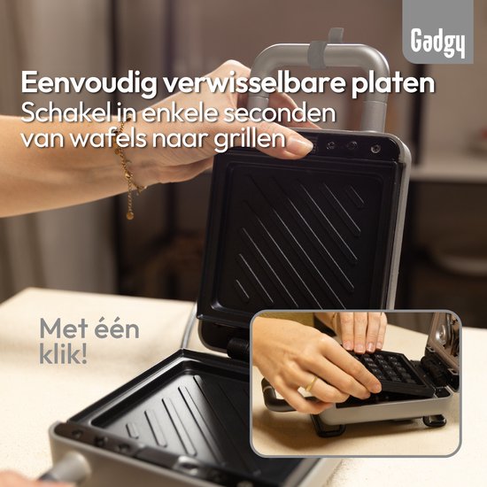 Handen wisselen wafelplaten in een grijze wafelijzer. De ijzer is geopend. Met één klik!