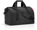 Zwarte weekendtas met handvatten, schouderband en een subtiel stippenpatroon.