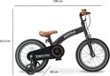 Vélo enfant Deryan noir avec touches de marron. Dimensions : 100 cm de long, 62,5 cm de haut, 40 cm de large. Avec roulettes.