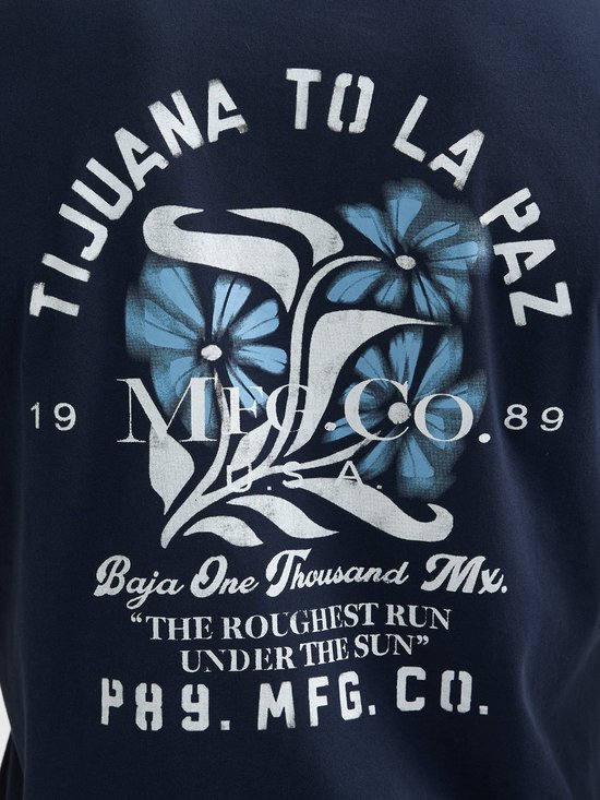 Donkerblauw T-shirt met grafische print van bloemen en tekst "Tijuana To La Paz", "Baja One Thousand Mx.", "The Roughest Run Under The Sun", "P89. MFG. CO."