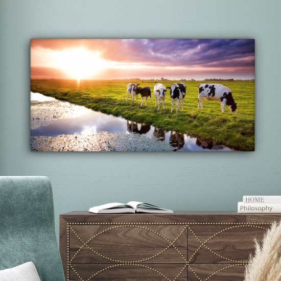 Tableau sur toile Vaches pendant un coucher de soleil - 80x40 cm - Décoration murale Art