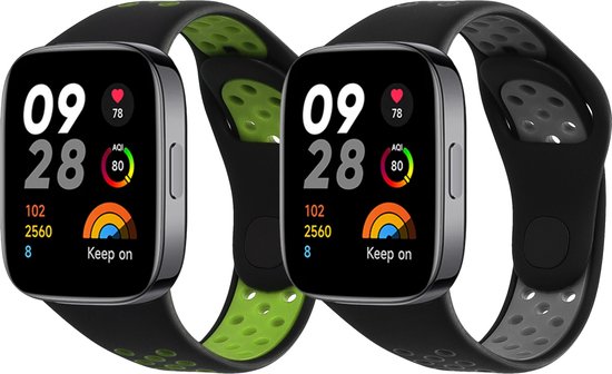 Deux bracelets de montre noirs avec des accents verts et gris. Les montres ont un écran noir affichant l'heure 09:28.