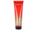 Een rode tube met witte en gouden tekst, waaronder 'REDKEN frizz dismiss rebel tame cream crème'.