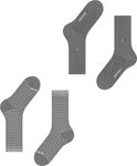 Drie paar grijze Burlington sokken. Twee effen met een zilverkleurig stipje, twee gestreept met lichtere grijze strepen.