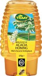Gele fles honing met een geel label met witte bloesemtakken en een acacia boom op een groen veld. De tekst luidt 'Biologische Acacia Honing'.