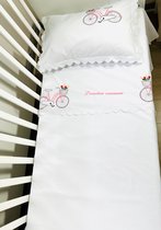 Personalized duvet cover with a pink bicycle and a dedication embroidered for junior bed