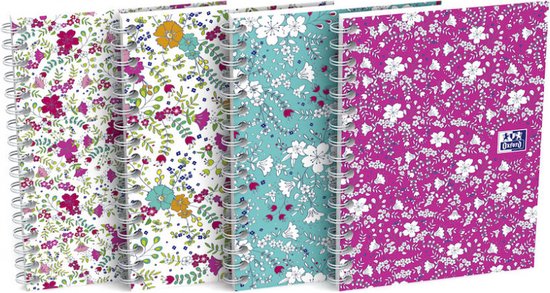 Vier A6 schrijfblokken naast elkaar: roze, wit met oranje en turkoois, turquoise met wit en roze, en roze met wit gebloemd.
