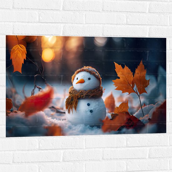 Muursticker - Sneeuwpop met Bruine Sjaal en Muts in de Sneeuw tussen de Herfstbladeren - 90x60 cm Foto op Muursticker