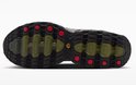 Onderkant van groene Nike Air Max Dn8 sneaker met zwart profiel en rode accenten.